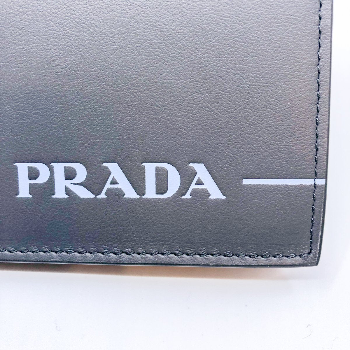 Prada Unisex Grey Blue Mirage Calf Leather Bifold Snap Wallet 1MV204
