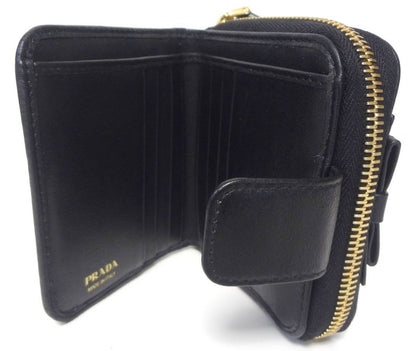 Prada Women's Black Nero Vitello Move Zip Flap Bow Wallet 1ML522
